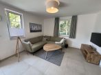 Neuwertig! Ferienappartement direkt am Strand! - Wohnzimmer