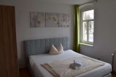 Rendite 5,9 % Wohn- und Geschäftshaus in bester Lage von Bischofswerda - Schlafzimmer